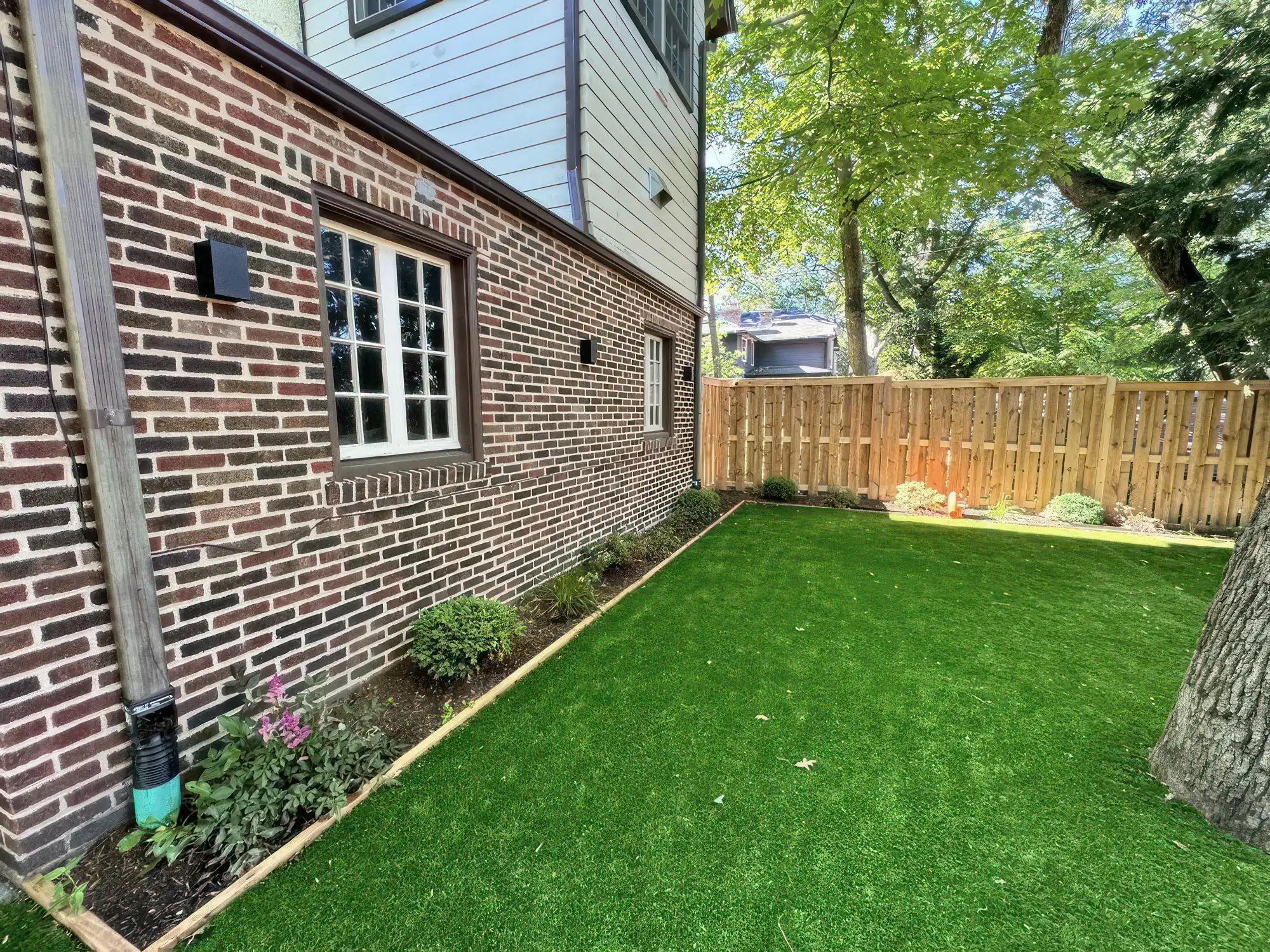 Freshly laid sod and edge plant design