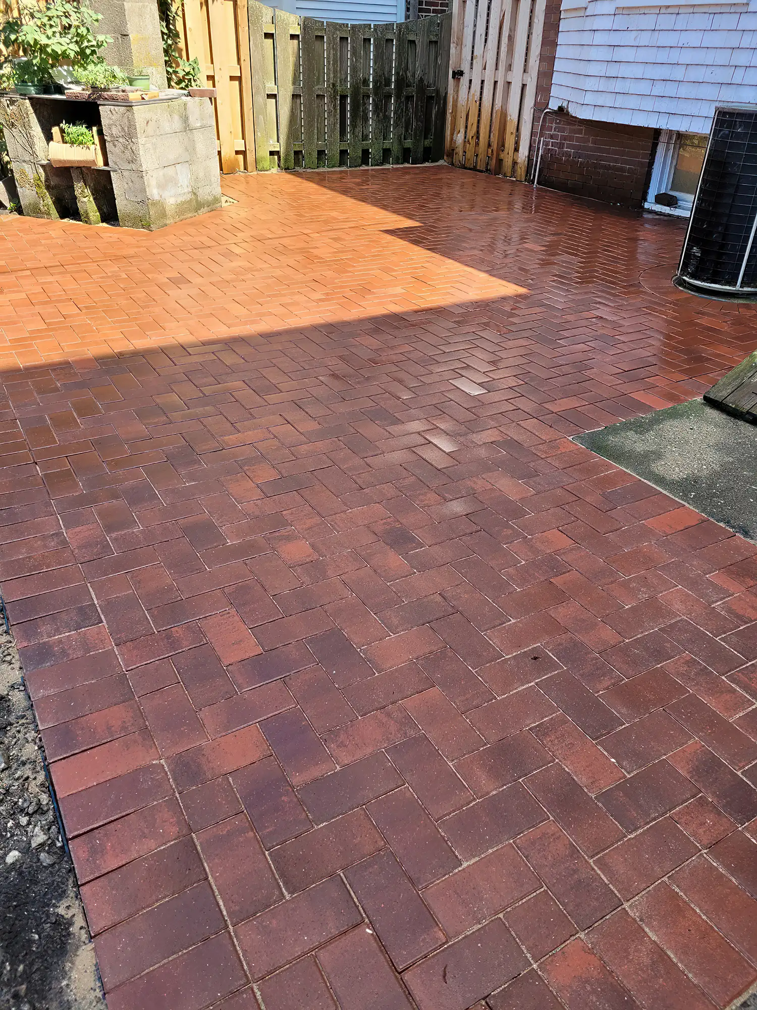 a mix of light and dark bricks in a geometric pattern