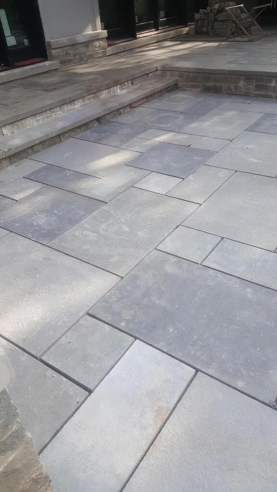 gorgeous flat stone patio with varied sized and colored stone
